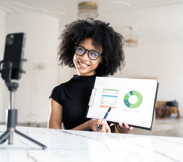 Cheerful influencer presenting statistics during a live stream, interactive and engaging.